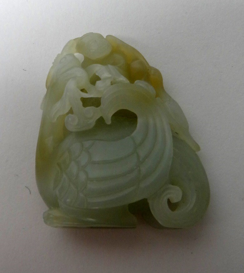 Appraisal: A Chinese pale celadon jade carving of a boy seated