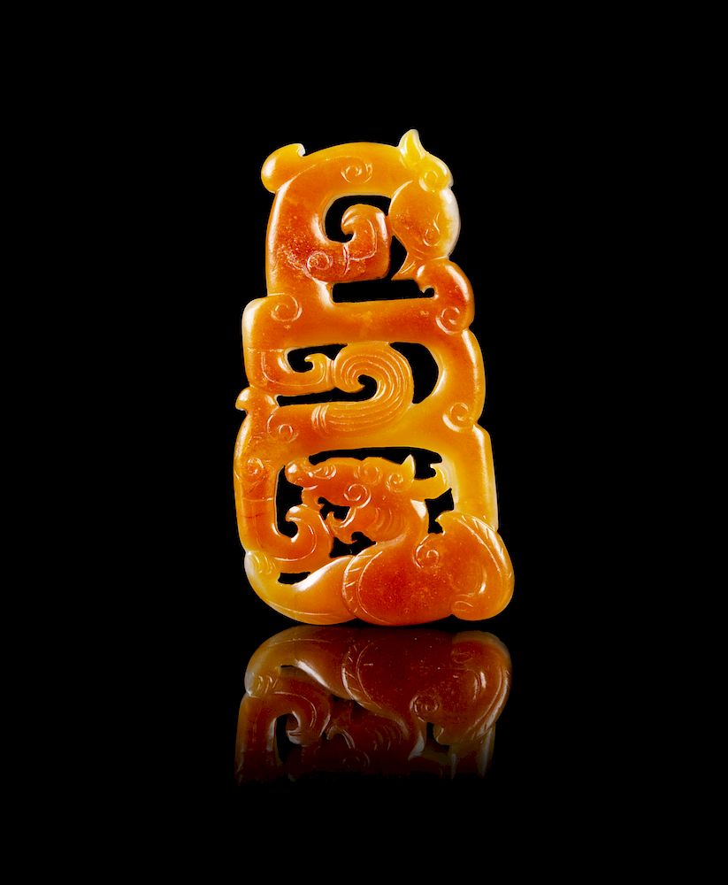 Appraisal: A Chinese Russet and White Jade Reticulated Pendant Height in