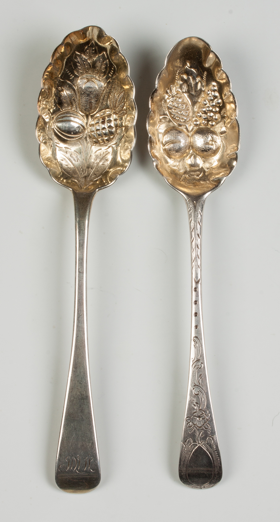 Appraisal: Two English Sterling Silver Serving Repousse Berry Spoons One monogrammed