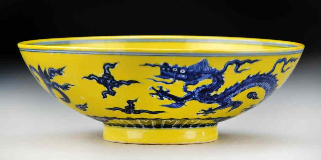 Appraisal: Chinese Blue Yellow Porcelain BowlFinely painted to depict a dragon