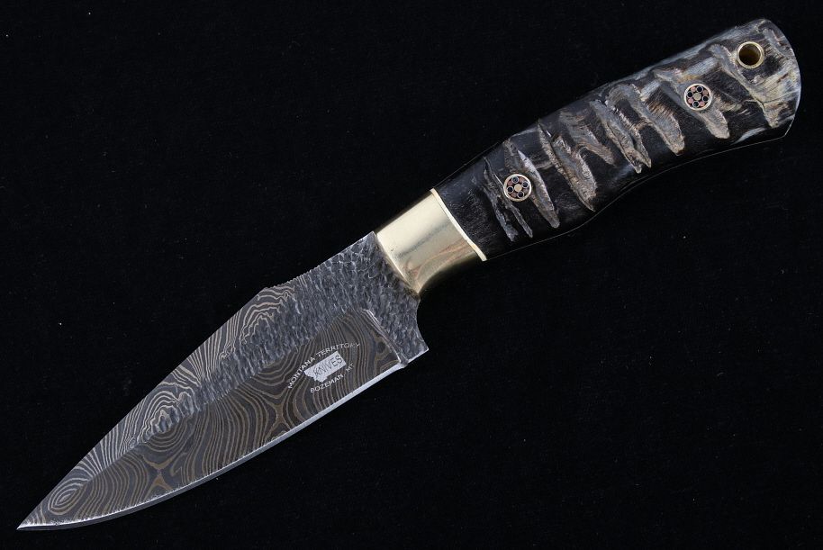 Appraisal: M T Knives Rams Horn Damascus Hammered Knife This is