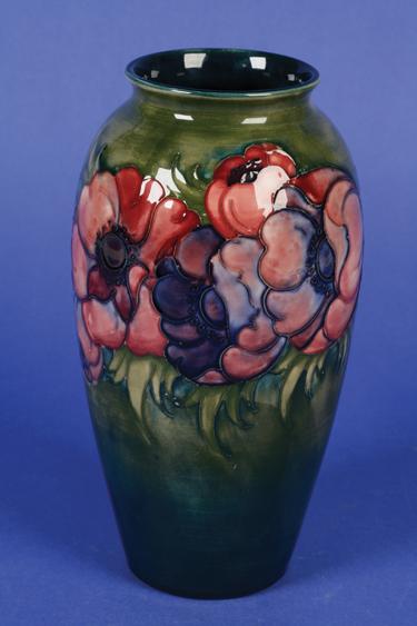 Appraisal: A MOORCROFT VASE of tapering form decorated in pinks and