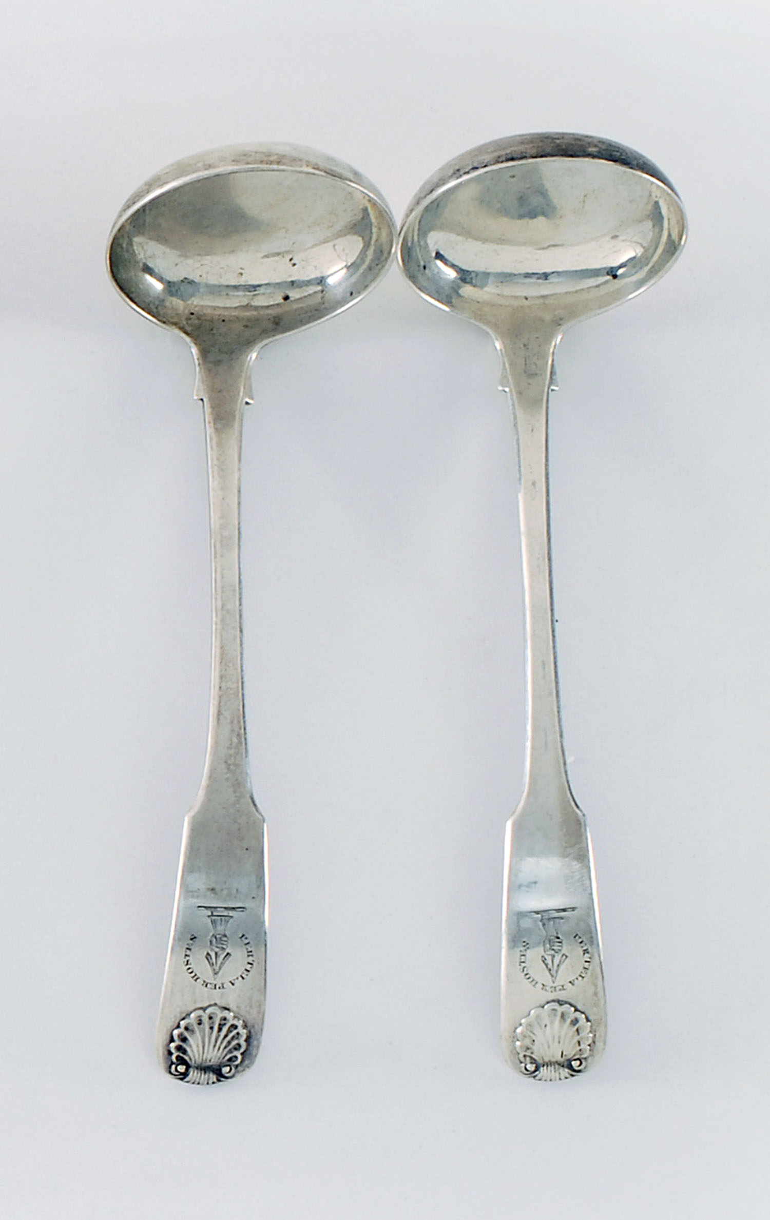 Appraisal: PAIR OF SCOTTISH SILVER SAUCE LADLES With shell-form handles Engraved