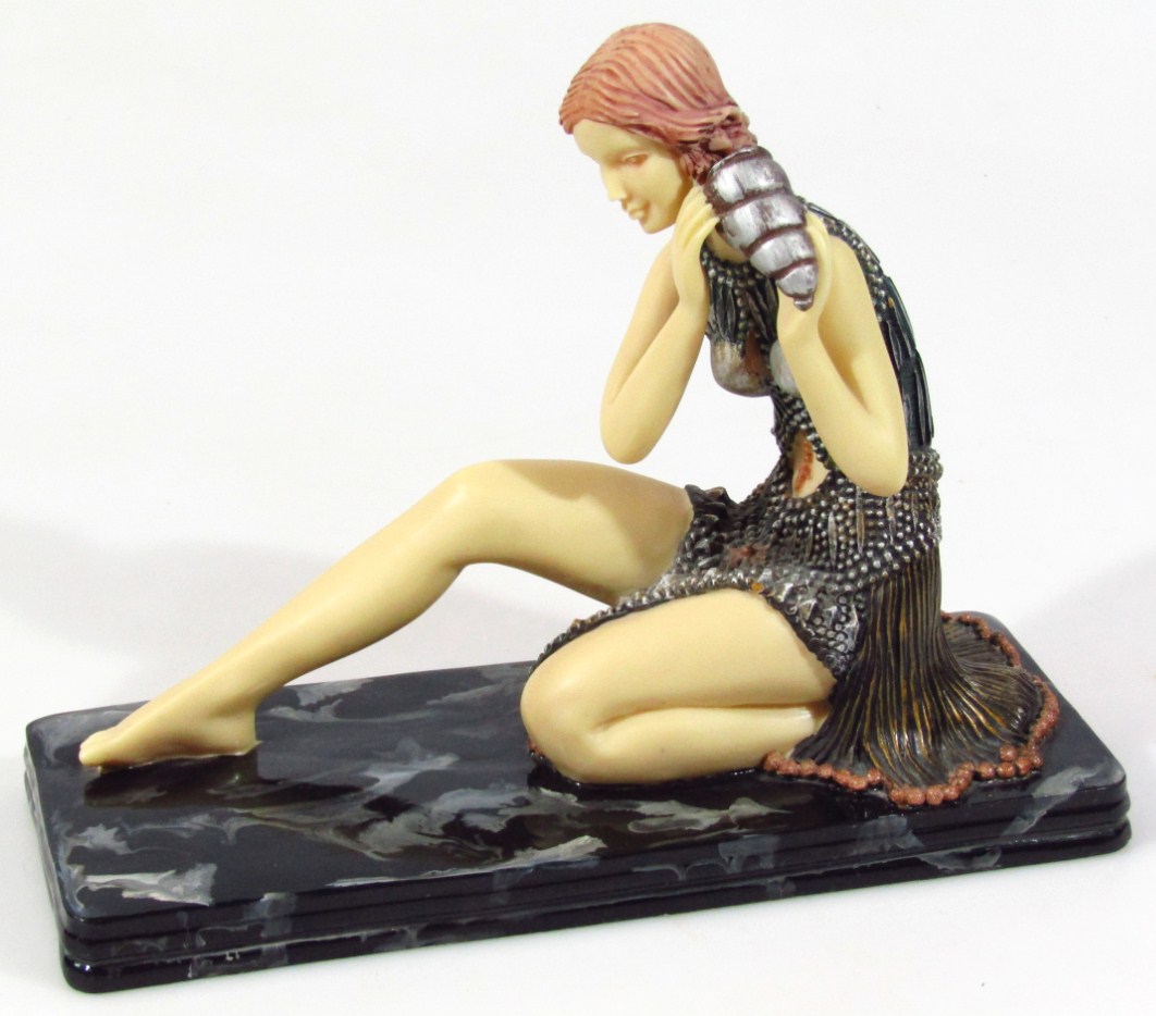 Appraisal: A modern art deco style figure of a lady in