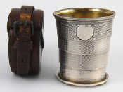 Appraisal: A Victorian campaign collapsible four section engine turned silver beaker