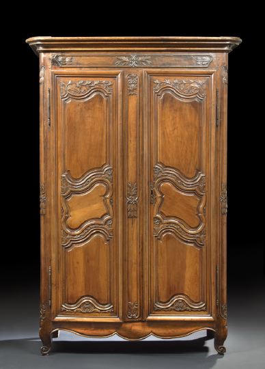 Appraisal: Provincial Louis XV-Style Walnut Armoire early th century the molded