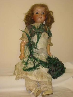 Appraisal: An Armand Marseille bisque head girl doll with brown glass