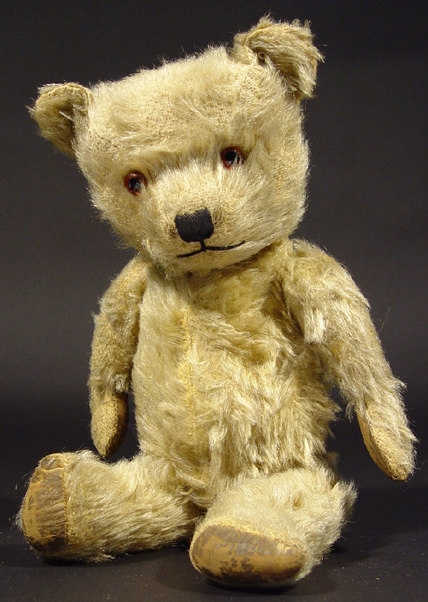 Appraisal: s golden teddy bear with jointed limbs and beaded eyes