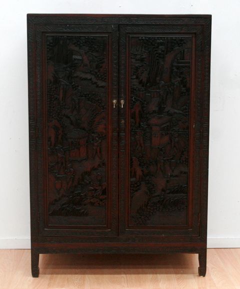 Appraisal: A carved Chinese th century camphorwood cabinet circa cms wide