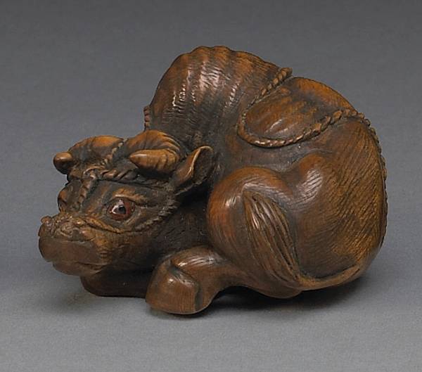 Appraisal: A stained boxwood study of an ox By Kangyoku Noriyoshi