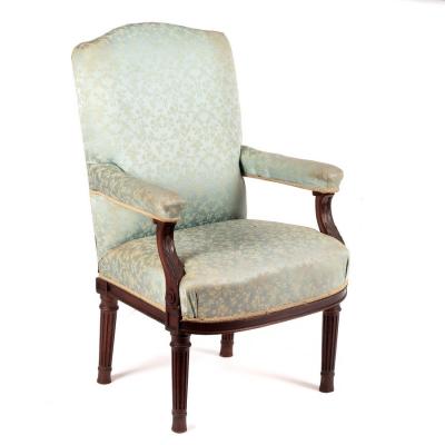 Appraisal: An upholstered armchair with acanthus carved arms on turned and