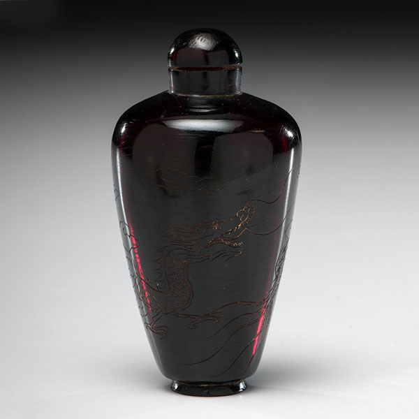 Appraisal: Chinese early th century An amber snuff bottle rounded elongated