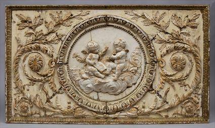 Appraisal: FRENCH LIMEWOOD OAK AND MAHOGANY RELIEF-CARVED PANEL With central rondel