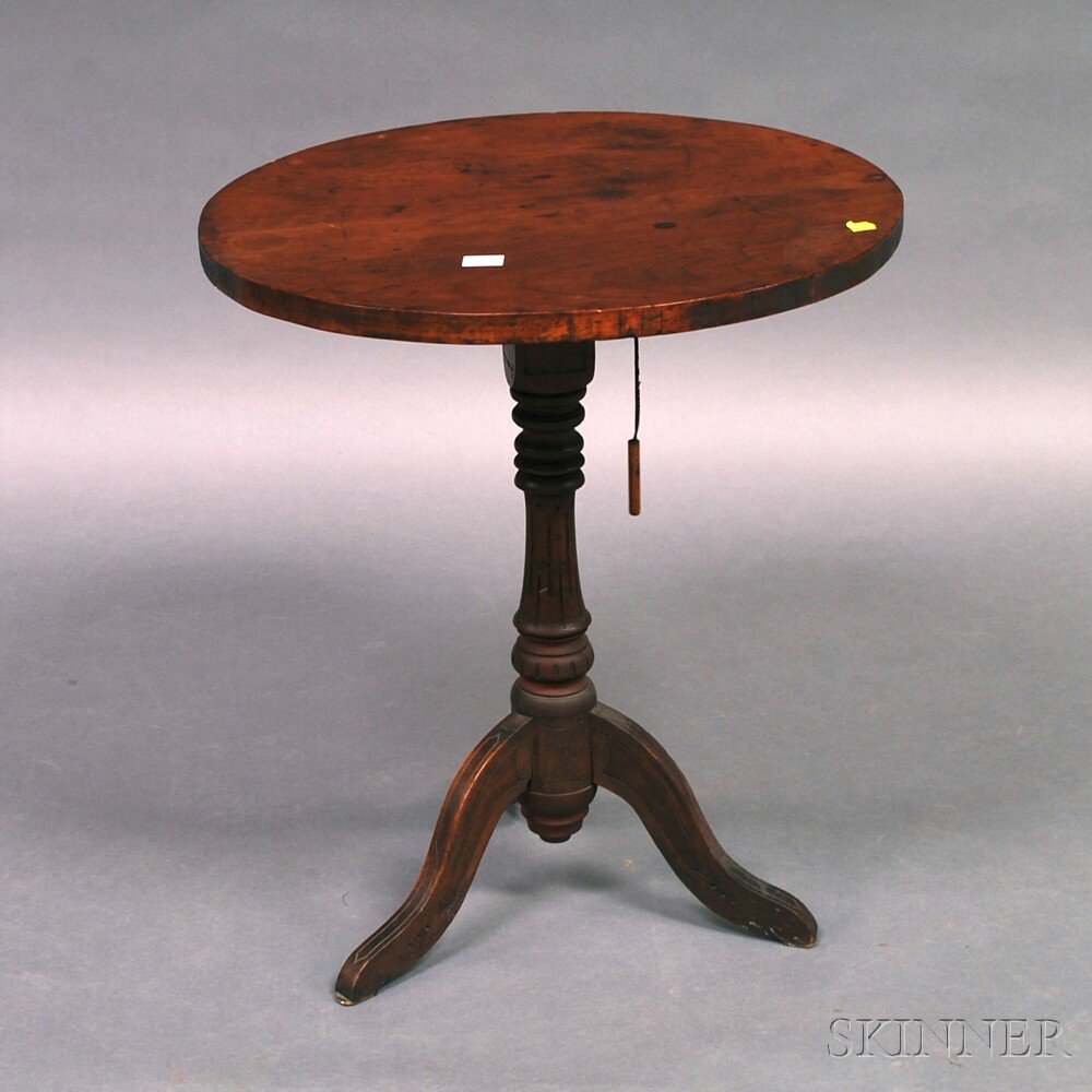 Appraisal: Country Carved Pine and Maple Tilt-top Candlestand ht dia in