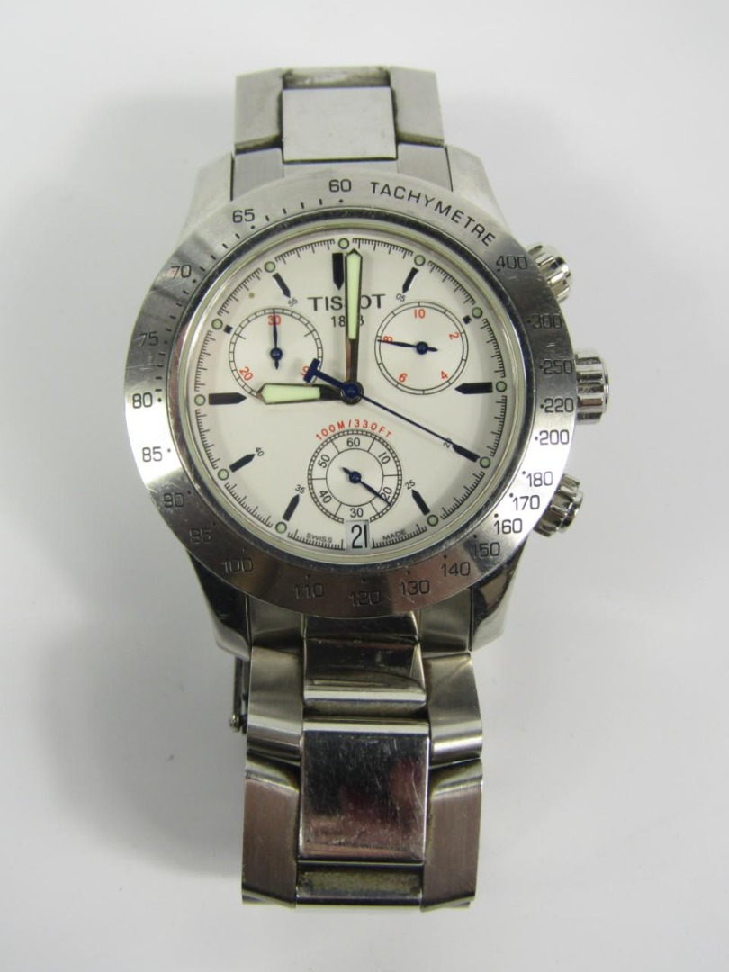 Appraisal: A gentleman's chronograph wristwatch white dial three subsidiary dials day