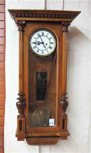 Appraisal: TWO-WEIGHT WALNUT CASE WALL CLOCK Gustav Becker Clock Co Freiberg