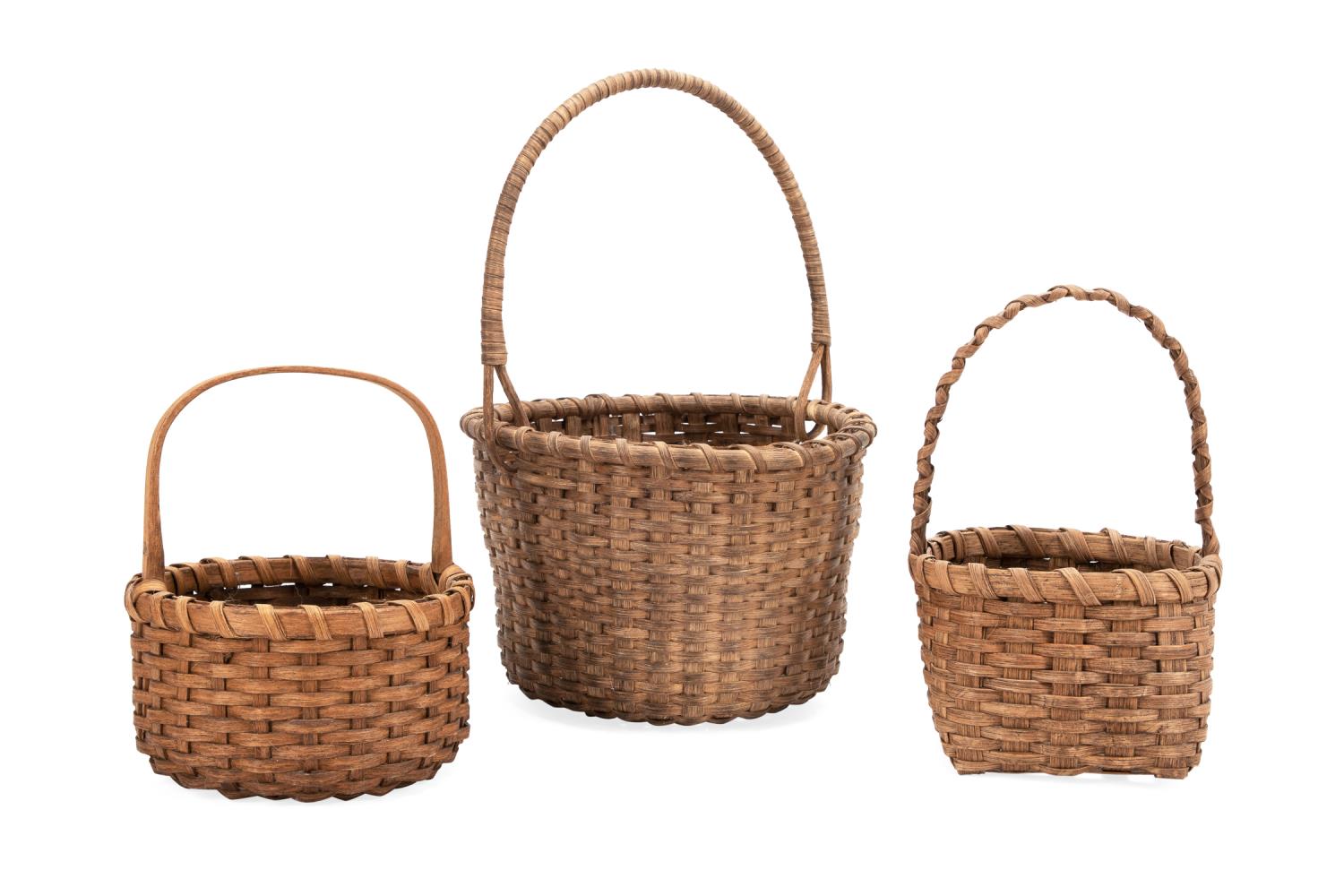 Appraisal: THREE HANDWOVEN REED BASKETS W HANDLES American School group of