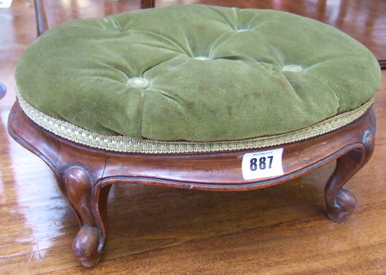 Appraisal: A Victorian rosewood oval footstool with button upholstered seat and