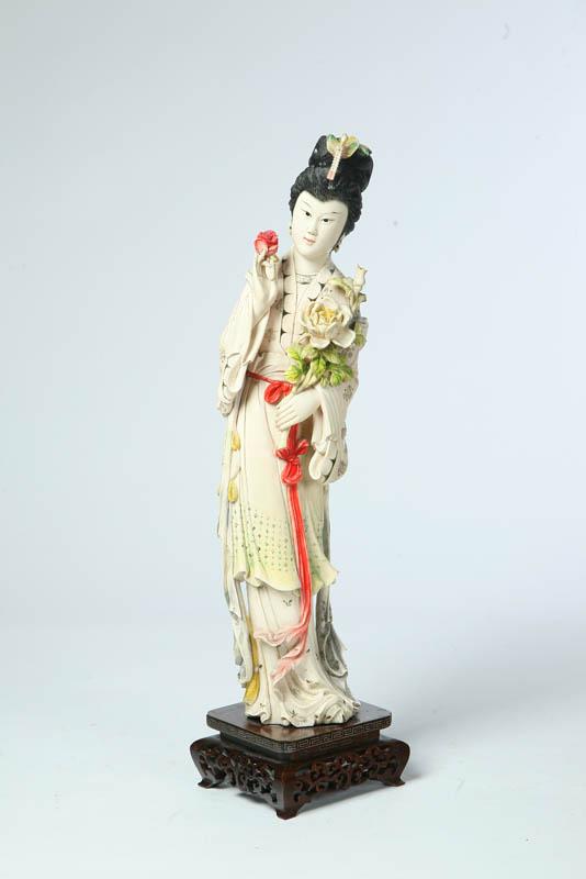 Appraisal: LARGE IVORY CARVING OF A WOMAN China th century Quan