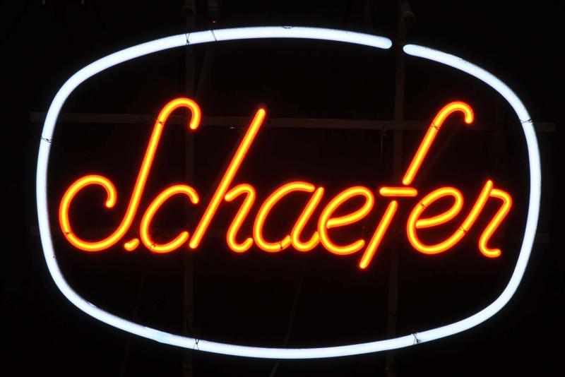 Appraisal: Schaefer Oval Neon Sign Description s to s White and