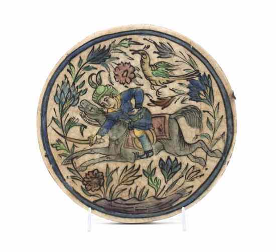 Appraisal: A Persian Ceramic Plaque of circular form depicting a figure