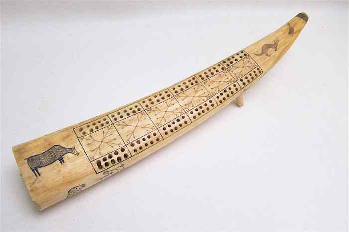 Appraisal: A MARINER'S IVORY WALRUS TUSK made as a cribbage board