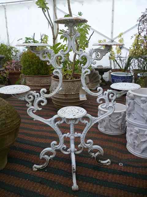 Appraisal: A WHITE PAINTED CAST IRON CONSERVATORY PLANT STAND to support