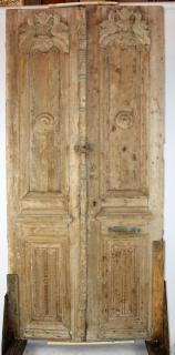 Appraisal: Pair of weathered carved wood entry doors A pair of