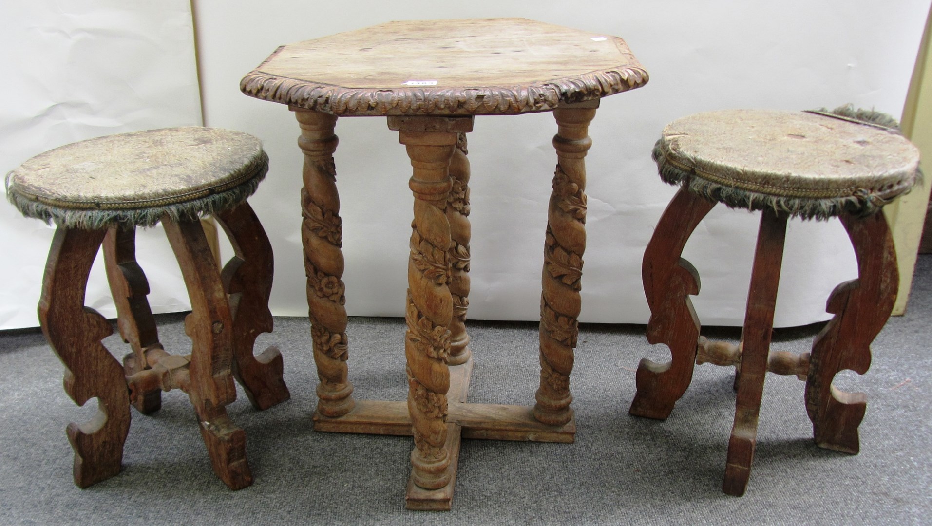 Appraisal: A pair of Spanish carved oak stools each with circular