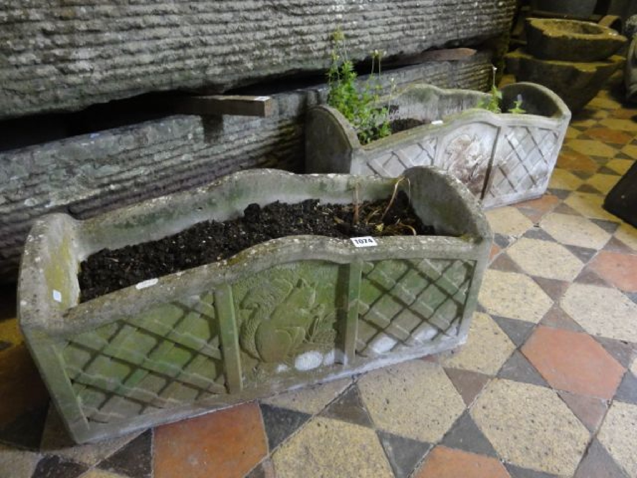 Appraisal: A pair of weathered cast contemporary composition stone garden planters