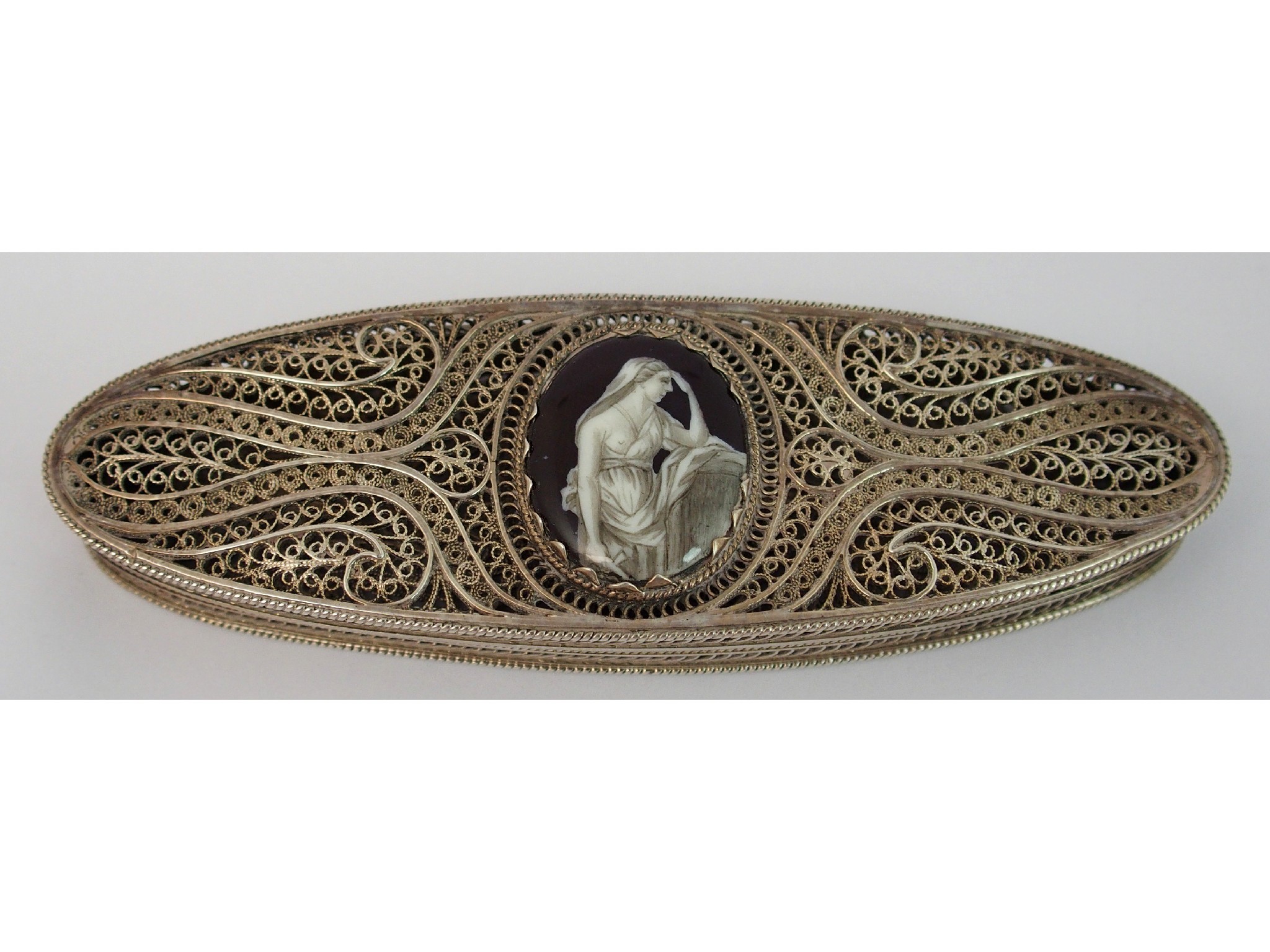 Appraisal: A filigree box of oval shapethe hinged lid set with