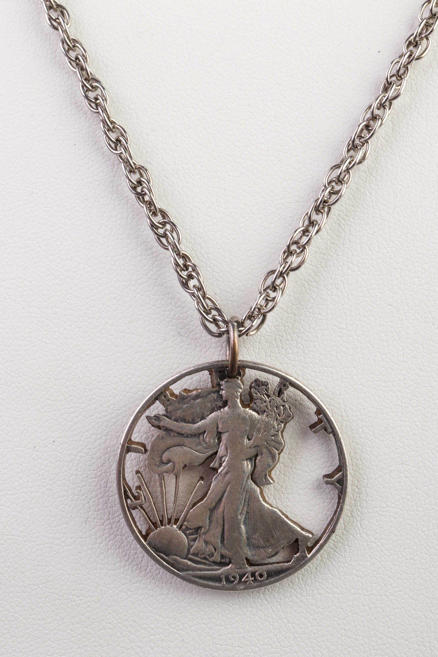 Appraisal: WALKING LIBERTY HALF DOLLAR CUT COIN NECKLACE Half dollar cut