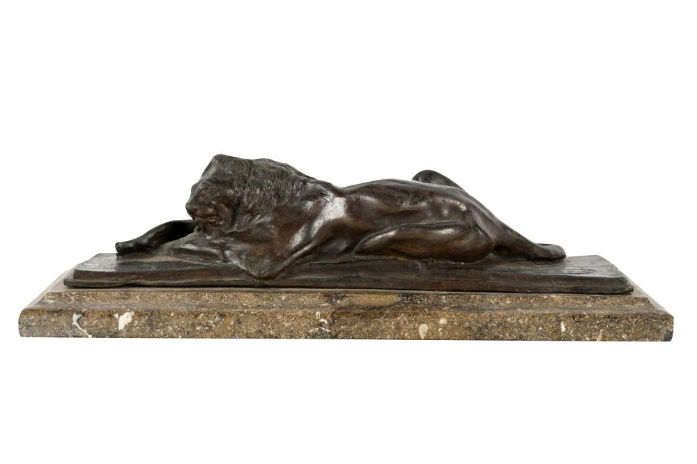 Appraisal: BRONZE FIGURE OF A RECLINING LIONsigned in casting P Trau