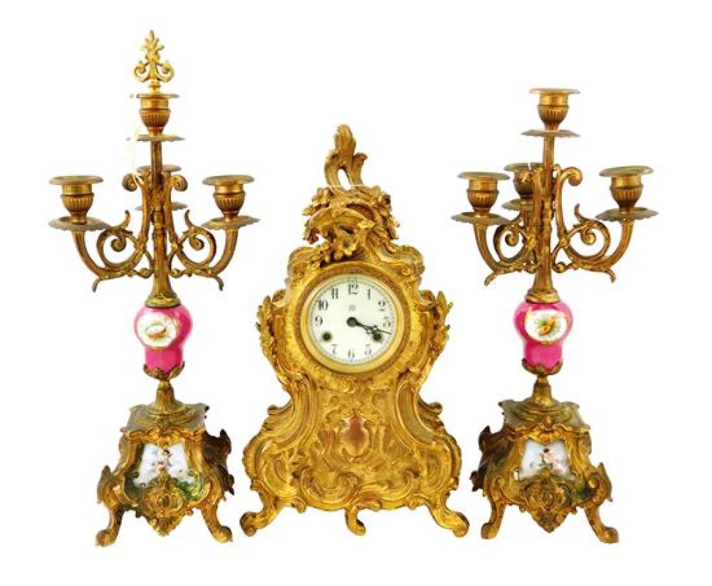 Appraisal: CLOCK Mantle clock and two candelabra Waterbury Clock Co gilt