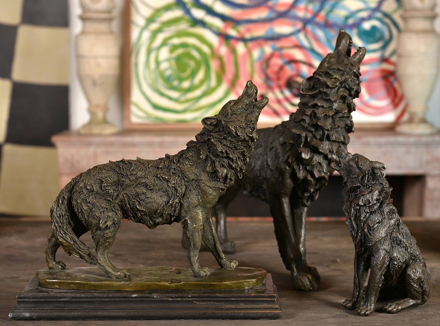 Appraisal: THREE BRONZE HOWLING WOLVES h x w x d