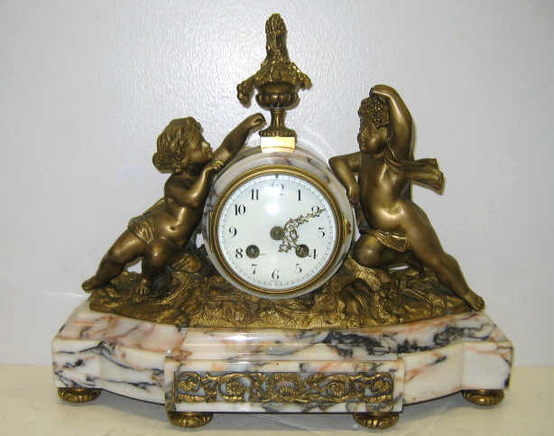 Appraisal: FRENCH GILT BRASS AND MARBLE MANTEL CLOCK Round veined marble