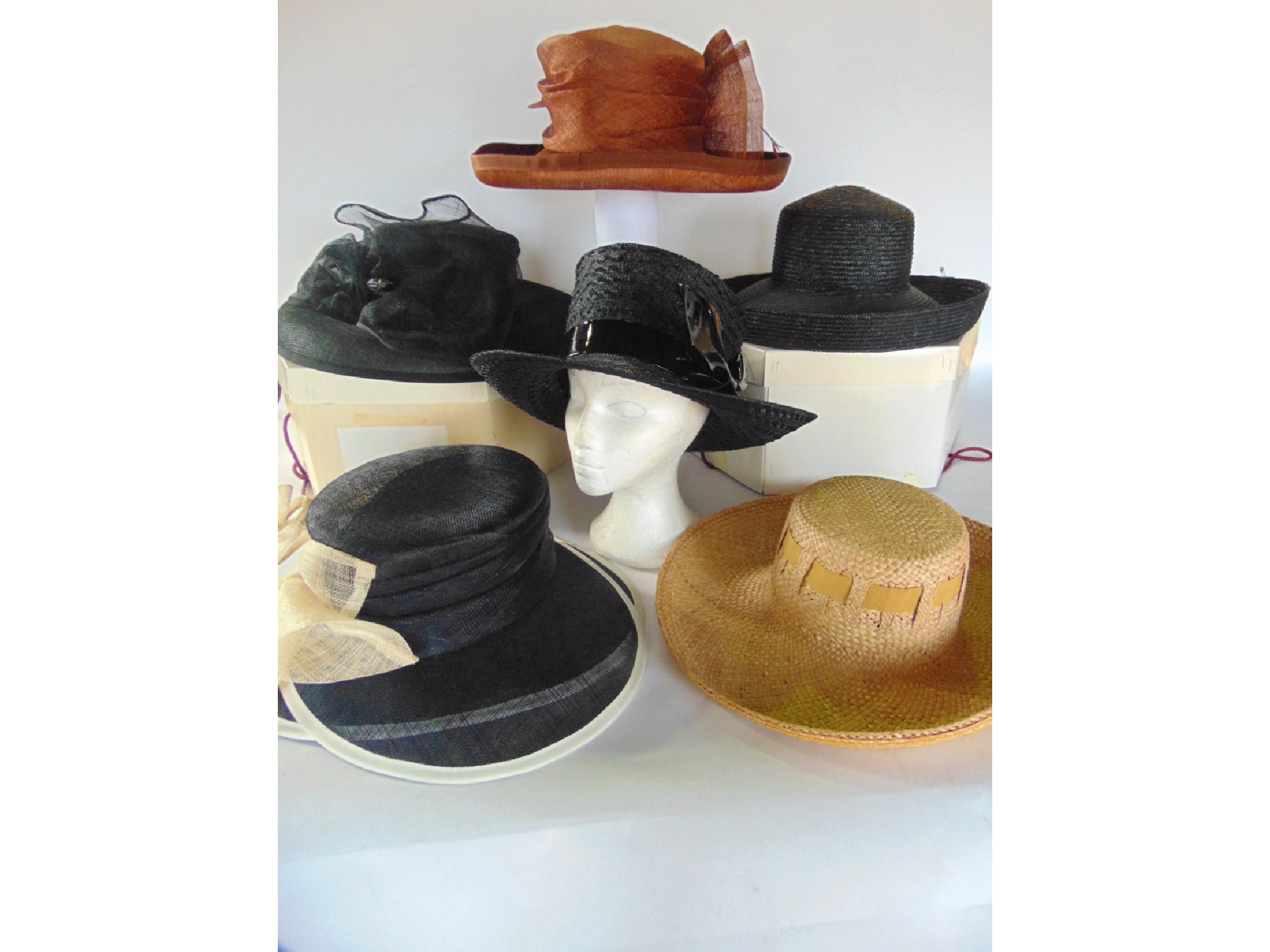 Appraisal: A collection of ladies hats including a black straw hat