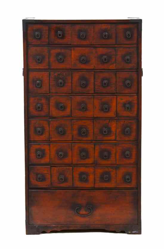 Appraisal: A Chinese Red Lacquered Apothecary Chest having thirty-five square drawers