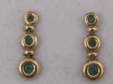 Appraisal: A pair of yellow metal tests ct gold and emerald