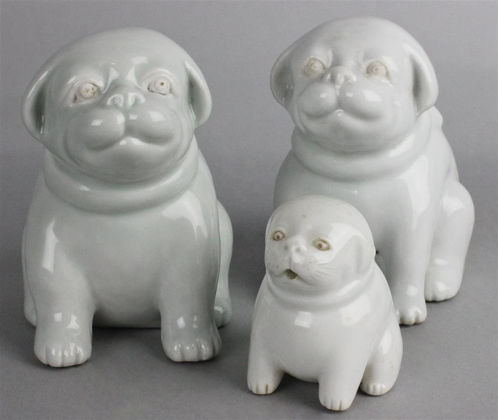 Appraisal: THREE JAPANESE HIRADO MODELS OF PUPPIES each modeled similarly seated