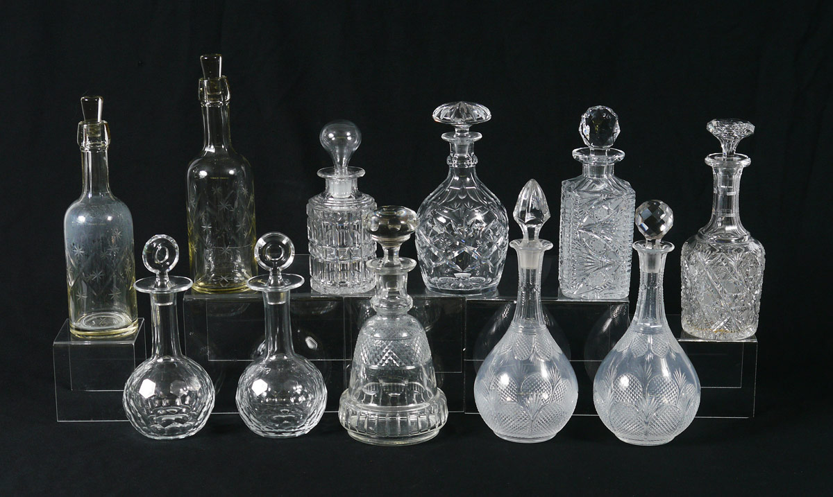 Appraisal: GROUP OF CRYSTAL DECANTERS Cut glass with faceted and hollow