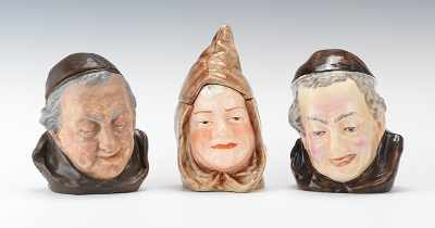 Appraisal: Three Monk Head Tobacco Jars Three examples of heads one