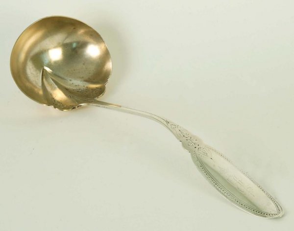 Appraisal: A large sterling punch ladle with overall bright cut decoration