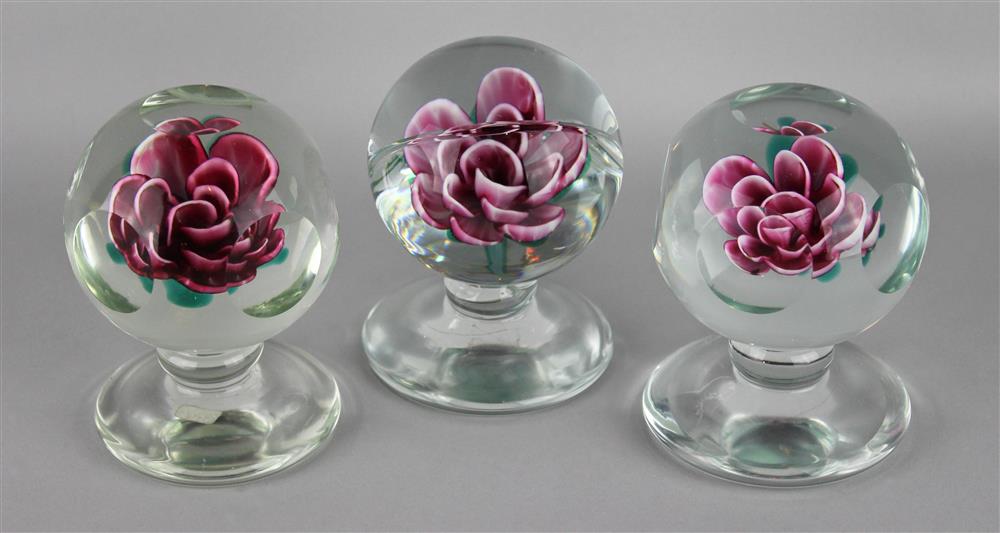 Appraisal: THREE PEDESTAL WEIGHTS EACH WITH SHADED ROSES the first two