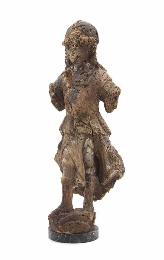 Appraisal: A Continental Carved Wood Santos Figure depicted in a standing