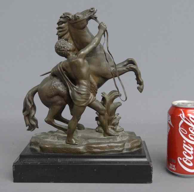 Appraisal: Bronze horse and handler on marble base '' W ''