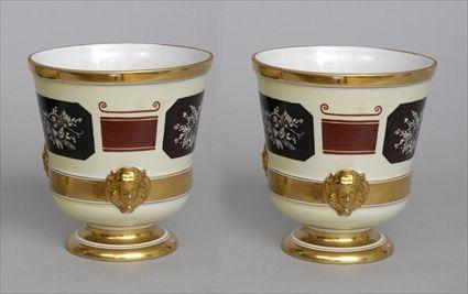 Appraisal: PAIR OF CONTINENTAL NEOCLASSICAL PORCELAIN WINE COOLERS Blue flambeau torch