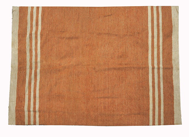 Appraisal: A LESOTHO CAMEL COLOURED WOOLLEN BLANKET OR FLOOR COVERING with