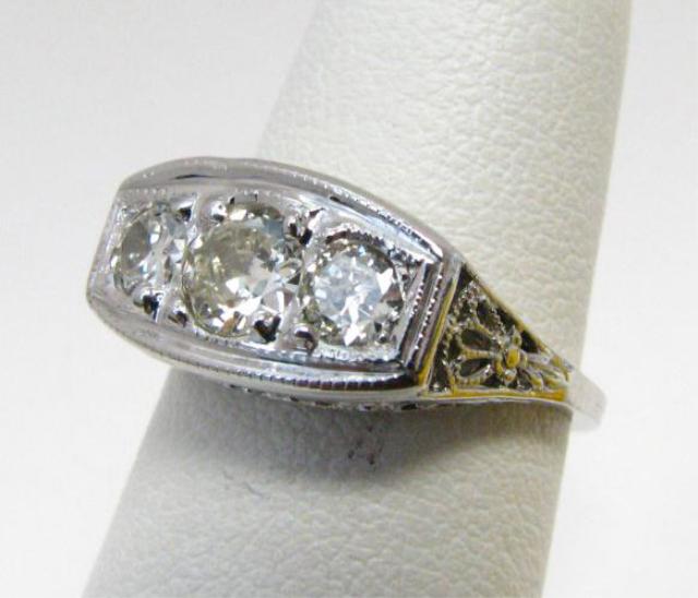 Appraisal: K White gold lady's filigree ring with three diamonds approximately