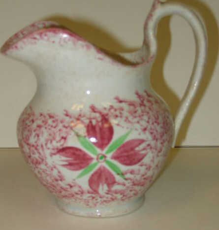 Appraisal: ENGLISH SPATTERWARE Red spatter creamer decorated with cluster of buds